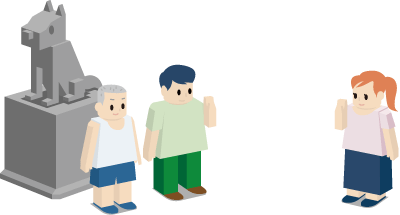 石像の前で待ち合わせる人たち